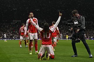 Arsenal's English midfielder Eberechi Eze (C) celebrates after scoring the team's third goal during the English Premier League football match between Tottenham Hotspur and Arsenal at the Tottenham Hotspur Stadium in London, on February 22, 2026.