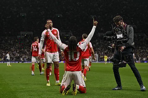 Arsenal's English midfielder Eberechi Eze (C) celebrates after scoring the team's third goal during the English Premier League football match between Tottenham Hotspur and Arsenal at the Tottenham Hotspur Stadium in London, on February 22, 2026.