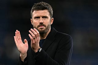 Manchester United's English Interim head coach Michael Carrick applauds the fans following the English Premier League football match between Everton and Manchester United at the Hill Dickinson Stadium in Liverpool, north west England on February 23, 2026.