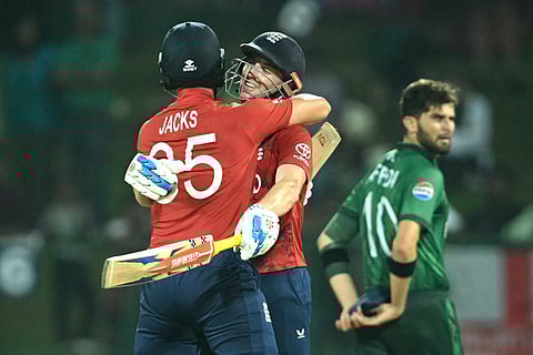 England captain Harry Brook (C) is congratulated by teammate Will Jacks (L) following his century (100 runs) during the 2026 ICC Men's T20 Cricket World Cup Super Eights match between England and Pakistan at the Pallekele International Cricket Stadium in Kandy on February 24, 2026.