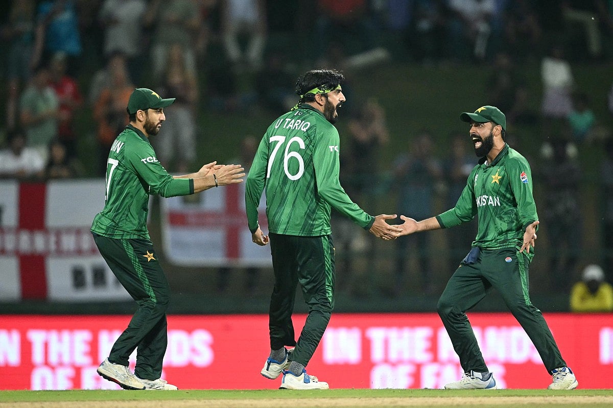 Pakistan's Usman Tariq (C) celebrates with teammates after taking the wicket of England's Tom Banton during the 2026 ICC Men's T20 Cricket World Cup Super Eights match between England and Pakistan at the Pallekele International Cricket Stadium in Kandy on February 24, 2026.