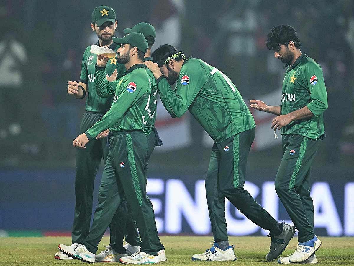 Pakistan players walk back after their defeat during the T20 World Cup Super Eights match against England at the Pallekele International Cricket Stadium in Kandy on February 24, 2026. 
