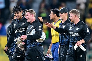 New Zealand's Rachin Ravindra (L) and wicketkeeper Tim Seifert (2L) celebrate their team's win at the end of the 2026 ICC Men's T20 Cricket World Cup Super Eights match between Sri Lanka and New Zealand at the R Premadasa Stadium in Colombo on February 25, 2026.