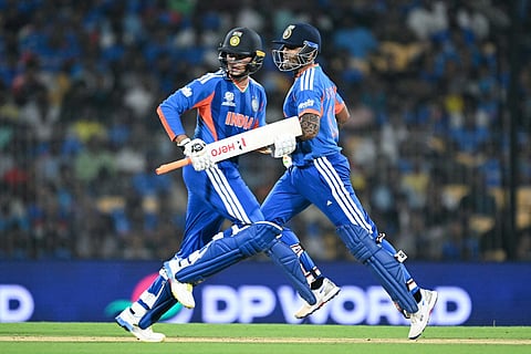 India’s captain Suryakumar Yadav (R) and teammate Abhishek Sharma (L) run between the wickets during the 2026 ICC Men's T20 Cricket World Cup Super Eights match between India and Zimbabwe at the MA Chidambaram Stadium in Chennai on February 26, 2026.