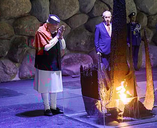 Prime Minister Narendra Modi during the floral wreath-laying ceremony at the Hall of Remembrance, in Israel on Thursday. Also seen is Benjamin Netanyahu.