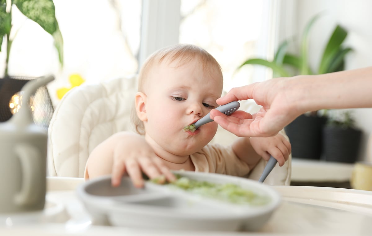 Cans of infant formula on a shelf during a product recall