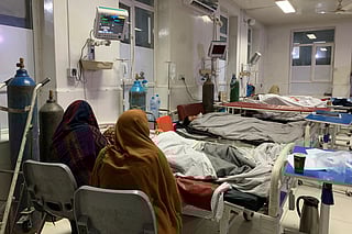 Wounded Afghan women receive treatment at a hospital in Jalalabad on February 27, 2026, after a Pakistani mortar shell hit a camp for people returning from Pakistan, during ongoing clashes between Pakistani forces and Taliban security personnel near the Torkham border crossing between Afghanistan and Pakistan in Nangarhar Province.