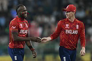 England's captain Harry Brook (R) and teammate Jofra Archer interact during the 2026 ICC Men's T20 Cricket World Cup Super Eights match between England and New Zealand at the R Premadasa Stadium in Colombo on February 27, 2026.