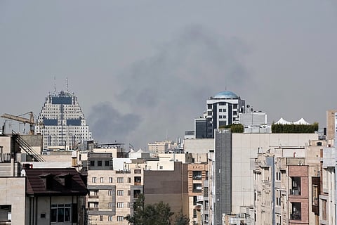Smoke rises on the skyline after an explosion in Tehran, Iran.