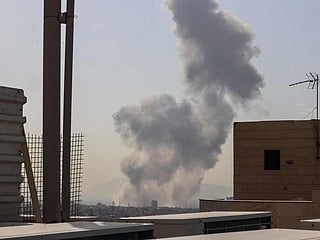 A plume of smoke rises following a reported explosion in Tehran on February 28, 2026. 