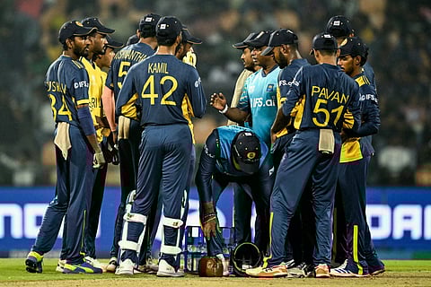 Sri Lanka's head coach Sanath Jayasuriya (5R) speaks to players during the 2026 ICC Men's T20 Cricket World Cup Super Eights match between Sri Lanka and Pakistan at the Pallekele International Cricket Stadium in Kandy on February 28, 2026.