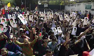 Protesters carrying portraits of Ayatollah Ali Khamenei, gather to protest against the US and Israeli attacks on Iran, in Lahore on March 1, 2026. White Star