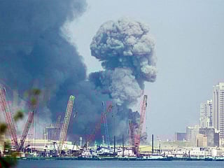 Smoke rises in the sky after blasts were heard in Manama.