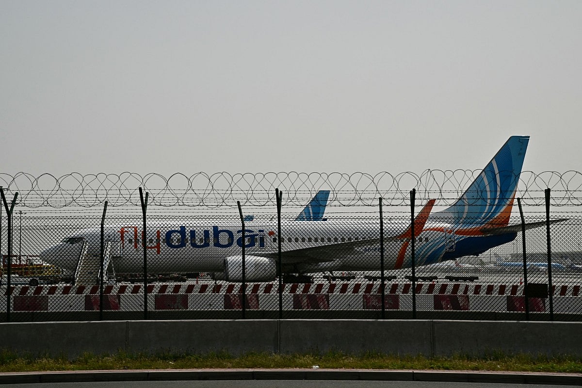 A flydubai plane is parked on the tarmac at Dubai International Airport as Iran retaliates following the US and Israel’s assassination of its supreme leader. 