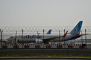 A flydubai plane is parked on the tarmac at Dubai International Airport as Iran retaliates following the US and Israel’s assassination of its supreme leader. 