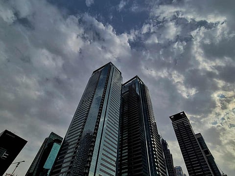 Clouds gather over Dubai’s skyline on Monday afternoon, signalling a cooler day ahead. NCM advises caution as winds and rain to affect multiple regions. 