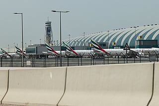 Emirates airline planes are parked on the tarmac at Dubai International Airport in Dubai on March 2, 2026.