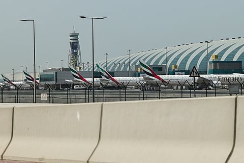 Emirates airline planes are parked on the tarmac at Dubai International Airport in Dubai on March 2, 2026.