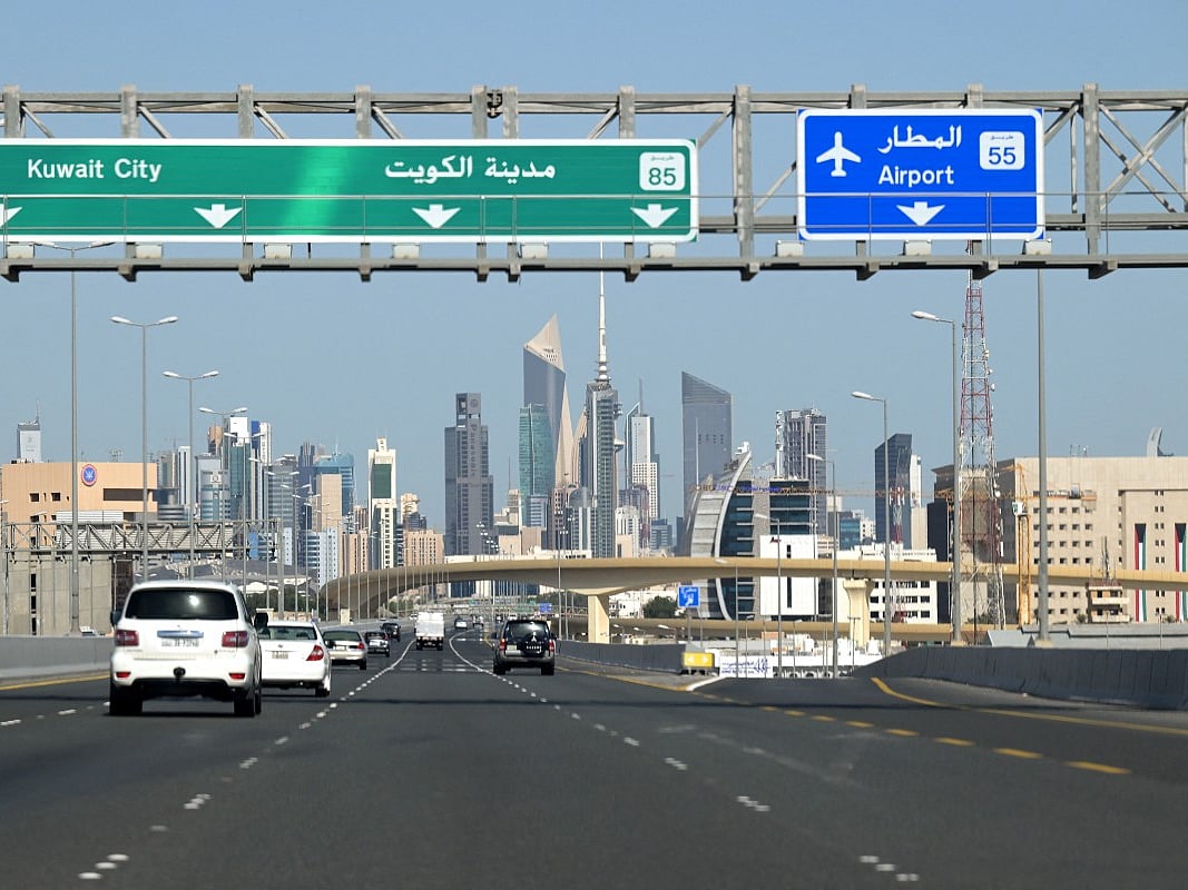 Vehicles drive along the highway leading to and from Kuwait City  