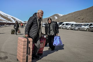 Iranian nationals arrive in Turkey after passing through the Razi-Kapiköy border crossing in Van, north-eastern Turkey, on March 3, 2026, a day after Turkey and Iran have mutually suspended day-trip crossings at their border as Israeli-US strikes continued to pound the Islamic Republic.