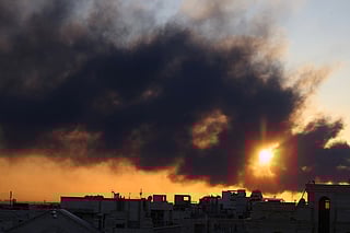 A plume of black smoke following a strike on the Iranian capital Tehran, on March 3, 2026.