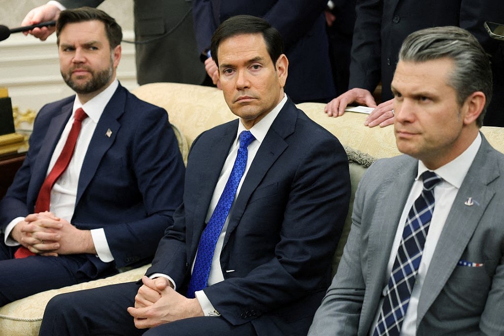 Vice President JD Vance, U.S. Secretary of State Marco Rubio and U.S. Secretary of War Pete Hegseth look on during a bilateral meeting with U.S. President Donald Trump and German Chancellor Friedrich Merz in the Oval Office of the White House on March 03, 2026 in Washington, DC. Trump and Merz are expected to discuss a range of topics including the recent U.S. and Israeli attacks on Iran and international tariffs imposed by the Trump administration.