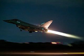 A handout picture taken on March 1, 2026 at the Royal Air Force (RAF) base in Akrotiri in Cyrpus and released by the British Ministry of Defence (MOD) on March 3, 2026 shows an RAF Typhoon aircraft from Britain's Royal Air Force (RAF) taking off for operations across the Middle East.