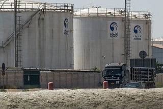 A truck drives past an ADNOC Gas — a subsidiary of the Abu Dhabi National Oil Company — facility in Abu Dhabi on March 3, 2026.