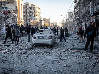 In this picture obtained from Iran's ISNA news agency on March 3, 2026, people and rescue workers search for victims after a strike on a building in Tehran's Enghelab Square. 