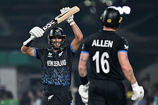 New Zealand's Rachin Ravindra (L) and Finn Allen celebrate their team's win at the end of the 2026 ICC Men's T20 Cricket World Cup semi-final match between New Zealand and South Africa in the Eden Gardens of Kolkata on March 4, 2026.