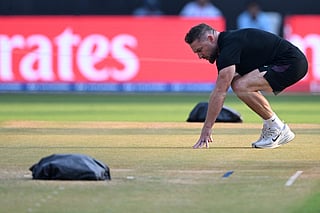 England’s head coach Brendon McCullum checks the pitch during a training session on the eve of their 2026 ICC Men's T20 Cricket World Cup semi-final match against India at the Wankhede Stadium in Mumbai on March 4, 2026.
