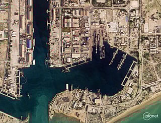 This satellite image taken by 2026 Planet Labs PBC shows damage at the military harbour in Iran's southern port of Bandar Abbas along the Strait of Hormuz on March 4, 2026.