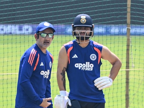 India's Rinku Singh (R) listens to coach Gautam Gambhir (L) during a training session ahead of the 2026 ICC Men's T20 Cricket World Cup’s semi-final match between India and England at the at the Wankhede Stadium in Mumbai on March 4, 2026.