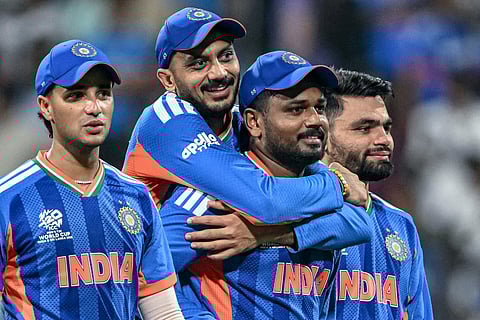 India's Abhishek Sharma, Axar Patel, Sanju Samson and Rinku Singh celebrate after their team's win in the 2026 ICC Men's T20 Cricket World Cup semi-final match against England at the Wankhede Stadium in Mumbai on March 5, 2026.
