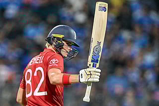 England's Jacob Bethell celebrates after scoring a half-century (50 runs) during the 2026 ICC Men's T20 Cricket World Cup semi-final match between India and England at the Wankhede Stadium in Mumbai on March 5, 2026.