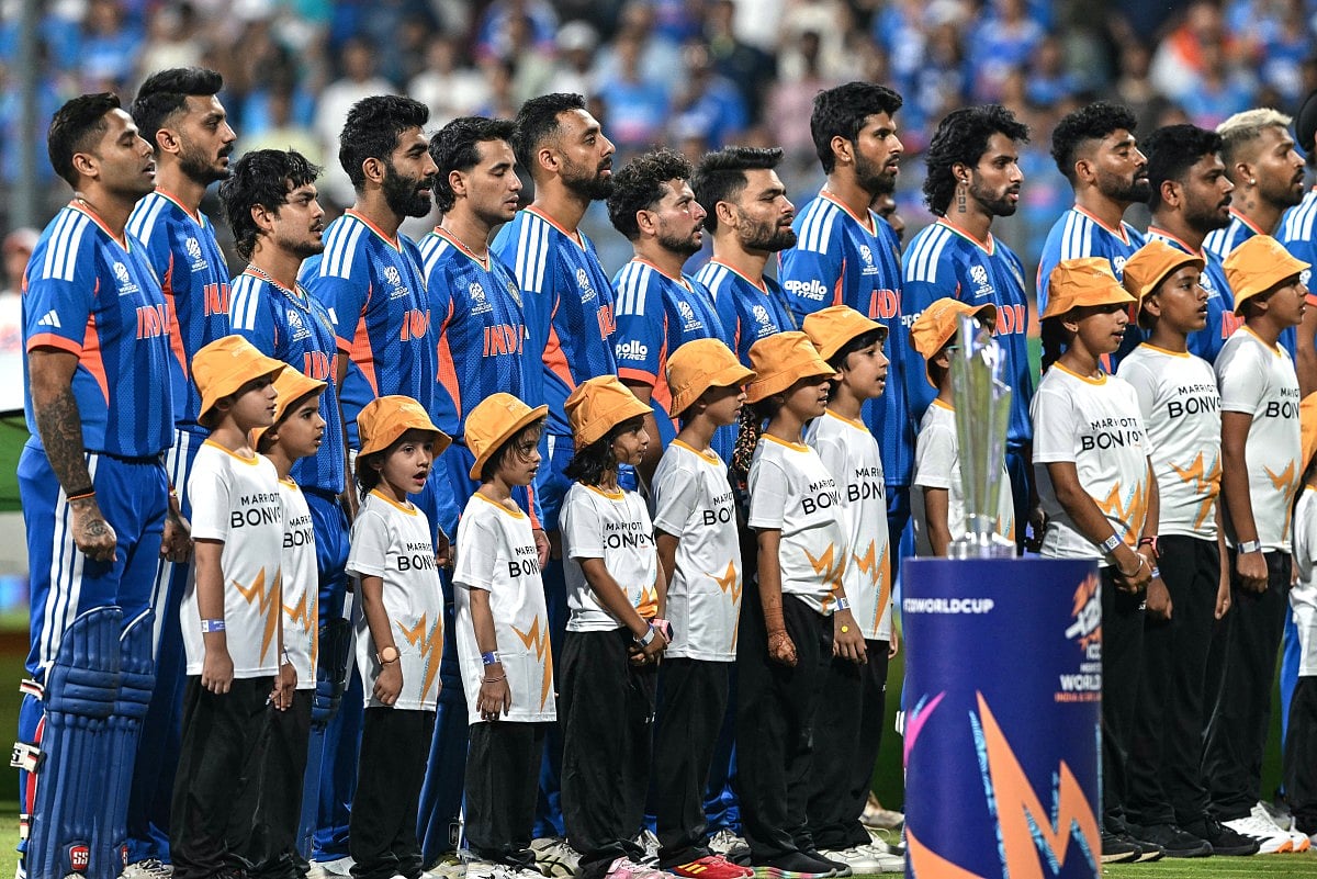India's players stand for their national anthem before the start of the 2026 ICC Men's T20 Cricket World Cup semi-final match between India and England at the Wankhede Stadium in Mumbai on March 5, 2026.