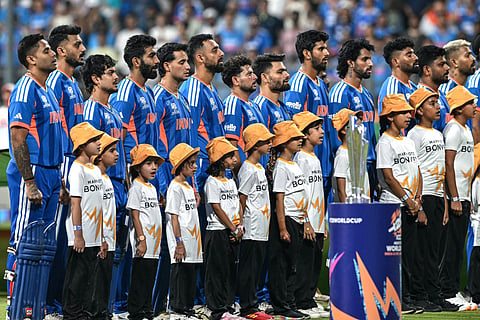 India's players stand for their national anthem before the start of the 2026 ICC Men's T20 Cricket World Cup semi-final match between India and England at the Wankhede Stadium in Mumbai on March 5, 2026.