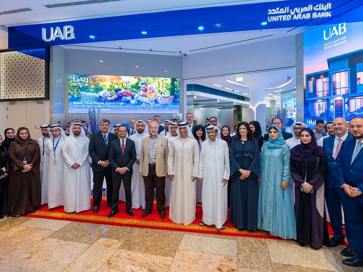 Sheikh Mohammed bin Faisal bin Sultan Al Qassimi inaugurates United Arab Bank’s new branch at Dubai Festival City, joined by CEO Shirish Bhide, Board members, and senior management.