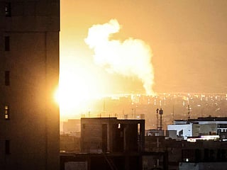 Smoke and fire rise from the site of airstrikes in a central area of the Iranian capital Tehran on March 6, 2026. 