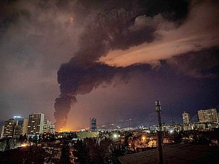 Flames and smoke rise from an oil storage facility struck as attacks hit Tehran, Iran 