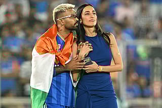 India's Hardik Pandya (L) with his girlfriend and model Mahieka Sharma celebrates after his team's win at the end of the 2026 ICC Men's T20 Cricket World Cup final match between India and New Zealand in the Narendra Modi Stadium of Ahmedabad on March 8, 2026.
