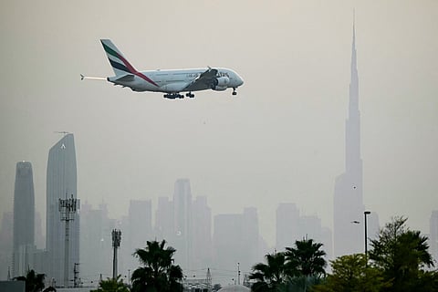 File picture of an Emirates Airbus A380 passenger aircraft prepares for landing at Dubai International Airport in Dubai on March 8, 2026.