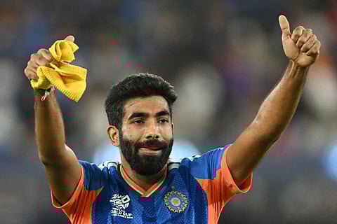 India's Jasprit Bumrah celebrates after taking the wicket of New Zealand's captain Mitchell Santner during the 2026 ICC Men's T20 Cricket World Cup final match between India and New Zealand at the Narendra Modi Stadium in Ahmedabad on March 8, 2026.
