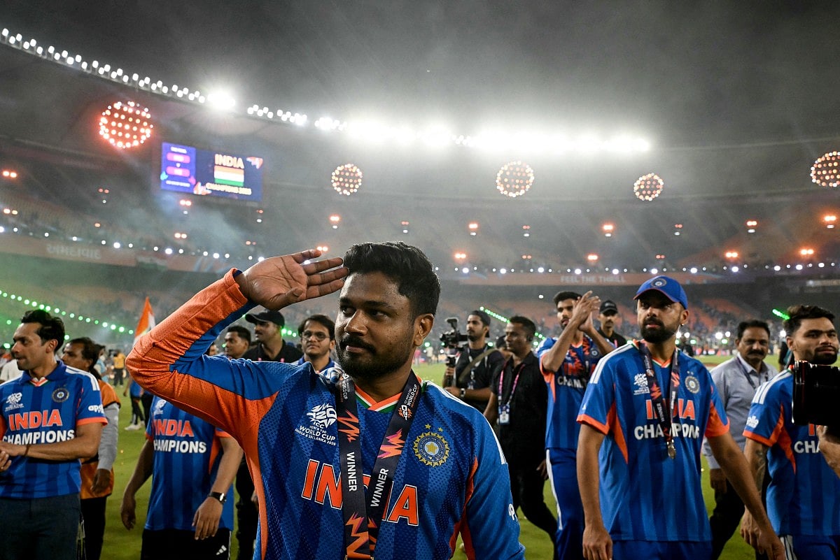 India's Sanju Samson with teammates greets fans during a victory lap after winning the 2026 ICC Men's T20 Cricket World Cup final match between India and New Zealand at the Narendra Modi Stadium in Ahmedabad on March 8, 2026.