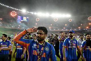 India's Sanju Samson with teammates greets fans during a victory lap after winning the 2026 ICC Men's T20 Cricket World Cup final match between India and New Zealand at the Narendra Modi Stadium in Ahmedabad on March 8, 2026.