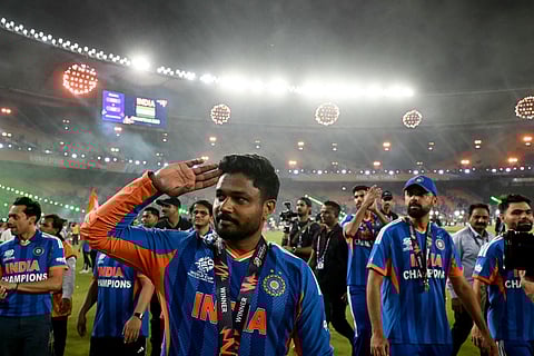 India's Sanju Samson with teammates greets fans during a victory lap after winning the 2026 ICC Men's T20 Cricket World Cup final match between India and New Zealand at the Narendra Modi Stadium in Ahmedabad on March 8, 2026.