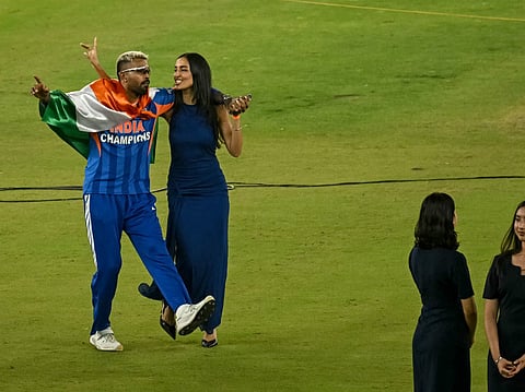 Indian cricketer Hardik Pandya (L) along with his girlfriend and model Mahieka Sharma (2L) celebrates after India's win in the 2026 ICC Men's T20 Cricket World Cup final match against New Zealand at the Narendra Modi Stadium in Ahmedabad on March 8, 2026.