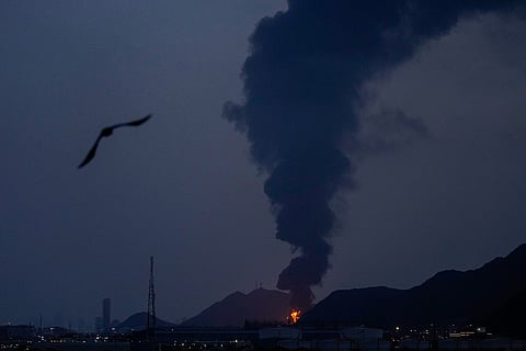Large fire and plume of smoke is visible after, according to the authorities, debris of an Iranian intercepted drone hit the Fujairah oil facility, in Fujairah, United Arab Emirates, Tuesday, March 3, 2026. 