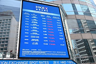 An electronic sign board showing stock prices is seen outside the Hong Kong Exchanges and Clearing (HKEX) building in Hong Kong. File photo taken on March 9, 2026.