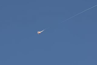 Rocket trails are seen in the sky above the Israeli coastal city of Tel Aviv amid a fresh barrage of Iranian missile attacks. File photo taken on March 9, 2026.